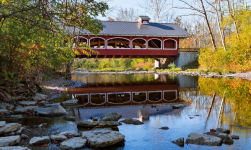 Covered bridge going over the lake